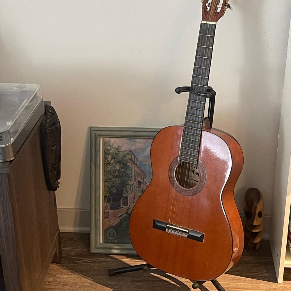 Lotus acoustic guitar with stand. Very good condition.